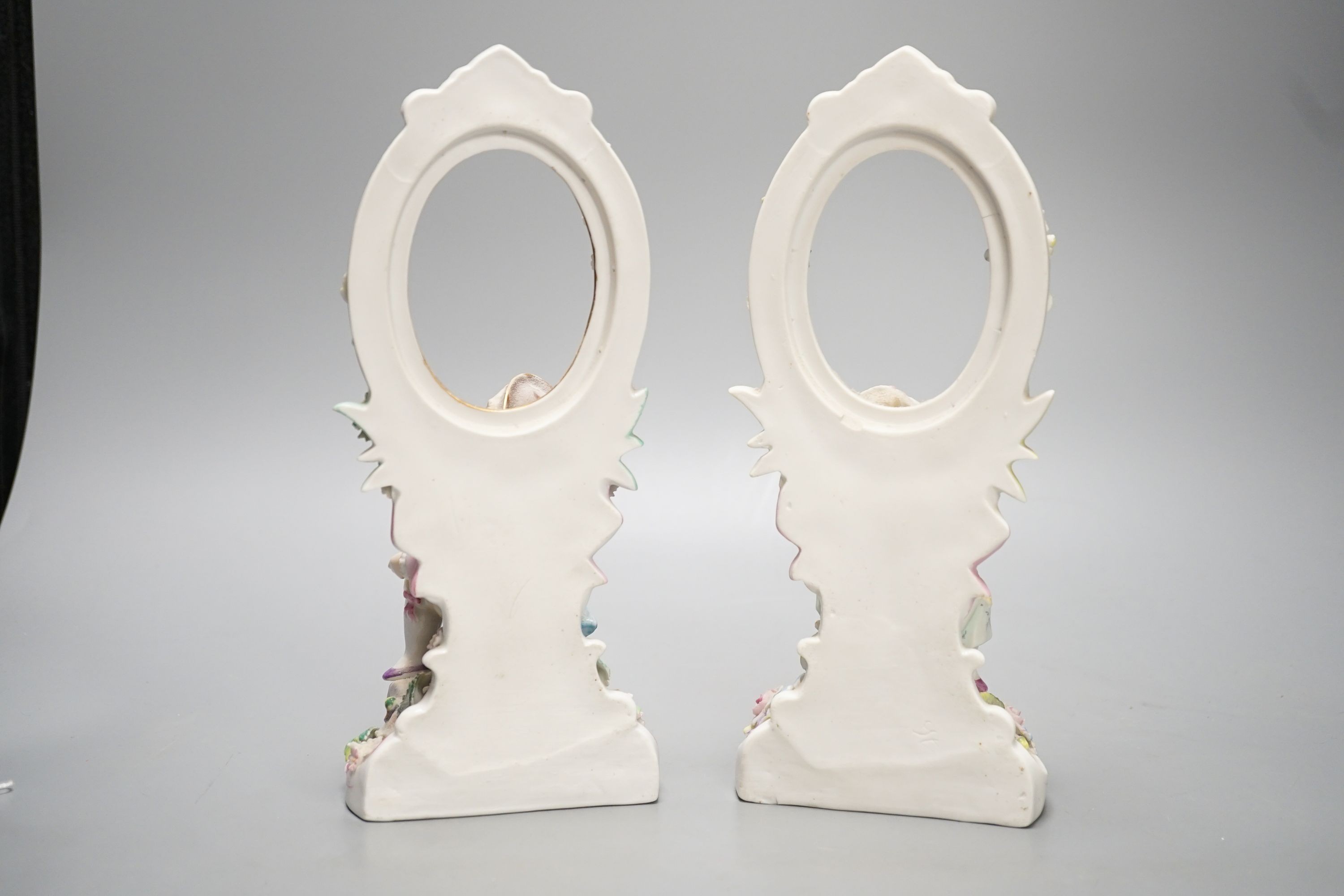 A pair of French porcelain figural photo frames, late 19th century, 24cm